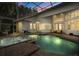 Backyard pool and spa in screened enclosure, perfect for outdoor relaxation and entertaining at 2241 Lake Vilma Dr, Orlando, FL 32835