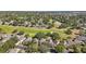 Beautiful aerial view of the golf course community with mature trees and well-maintained landscaping at 2302 Edmonton Ct, Clermont, FL 34711