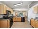 Well-equipped kitchen with modern appliances, granite countertops, and an open layout to the dining area at 2302 Edmonton Ct, Clermont, FL 34711