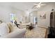 Cozy living room with vaulted ceiling, comfortable seating, neutral tones, and plenty of natural light at 2302 Edmonton Ct, Clermont, FL 34711