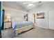 Spacious main bedroom featuring vaulted ceilings, neutral paint, carpet flooring and a king size bed at 2302 Edmonton Ct, Clermont, FL 34711