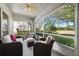 Relaxing screened porch with comfortable seating, perfect for enjoying the view and fresh air at 2302 Edmonton Ct, Clermont, FL 34711