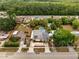 Aerial view of neighborhood showcasing lush landscaping, pool, homes, and neighborhood at 2303 Bonneville Dr, Orlando, FL 32826