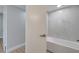 A bathroom featuring gray and white tile and a bathtub with shower at 2303 Bonneville Dr, Orlando, FL 32826