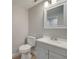 Updated bathroom featuring gray vanity and modern fixtures at 2303 Bonneville Dr, Orlando, FL 32826