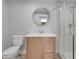 Modern bathroom featuring a wood vanity, updated mirror, and glass enclosed shower at 2303 Bonneville Dr, Orlando, FL 32826