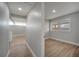A bright bedroom featuring wood-look flooring and a window with a view of the outdoors at 2303 Bonneville Dr, Orlando, FL 32826