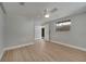 Bedroom with ceiling fan, neutral walls and wood-look floors at 2303 Bonneville Dr, Orlando, FL 32826