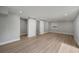A spacious bedroom featuring wood-look flooring and a closet with double sliding doors at 2303 Bonneville Dr, Orlando, FL 32826