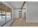 Bonus room with a sliding glass door, white walls, and access to other parts of the home at 2303 Bonneville Dr, Orlando, FL 32826