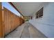 Extended carport offering ample covered parking, with a fenced yard visible on one side at 2303 Bonneville Dr, Orlando, FL 32826