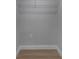 Small empty closet featuring wood floors, gray walls, and built-in shelving at 2303 Bonneville Dr, Orlando, FL 32826