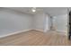 Clean, empty room with light gray walls, wood floors, and a ceiling fan at 2303 Bonneville Dr, Orlando, FL 32826