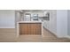 Modern kitchen featuring an island with seating and stainless-steel appliances at 2303 Bonneville Dr, Orlando, FL 32826