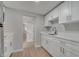 Modern kitchen featuring white cabinets, stainless steel appliances, and streamlined design at 2303 Bonneville Dr, Orlando, FL 32826