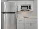 Contemporary kitchen featuring stainless steel appliances and white quartz countertops at 2303 Bonneville Dr, Orlando, FL 32826
