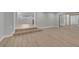 Spacious living room with modern flooring, neutral walls, and sliding glass door at 2303 Bonneville Dr, Orlando, FL 32826