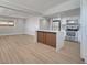 Bright, open-concept living space with modern kitchen island and stainless steel appliances at 2303 Bonneville Dr, Orlando, FL 32826