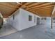 Covered patio with painted wood ceiling, neutral walls and sliding glass doors create outdoor living space at 2303 Bonneville Dr, Orlando, FL 32826