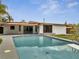 Backyard pool with diving board, surrounded by patio and access to the home through sliding glass doors at 2303 Bonneville Dr, Orlando, FL 32826