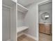 A walk-in closet featuring built-in shelving and a rod for hanging clothes at 2303 Bonneville Dr, Orlando, FL 32826