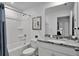 Bright bathroom featuring a tub, granite countertop, and modern fixtures at 2382 Zaballina Pl, Kissimmee, FL 34747