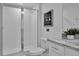Bright bathroom featuring a walk-in shower, granite countertop, and modern fixtures at 2382 Zaballina Pl, Kissimmee, FL 34747