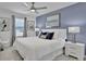 Comfortable bedroom featuring a king bed, ceiling fan, and modern décor at 2382 Zaballina Pl, Kissimmee, FL 34747