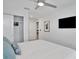 Bright bedroom featuring a bed, TV, and closet at 2382 Zaballina Pl, Kissimmee, FL 34747