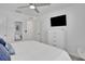 Modern bedroom featuring a bed, TV, and closet at 2382 Zaballina Pl, Kissimmee, FL 34747