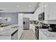 Well-equipped kitchen showcasing granite countertops, stainless steel appliances, and ample cabinet space at 2382 Zaballina Pl, Kissimmee, FL 34747