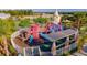 Community playground with slides and climbing area, surrounded by a fence and lush landscaping at 2382 Zaballina Pl, Kissimmee, FL 34747