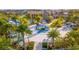 Community water park featuring a blue slide and splash area surrounded by tropical landscaping at 2382 Zaballina Pl, Kissimmee, FL 34747