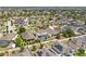 Aerial view of a suburban neighborhood featuring a two-story home with a screened pool and backyard at 242 Milestone Dr, Haines City, FL 33844