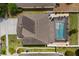 Aerial view showcasing the roof, screened in pool and spacious fenced-in yard of the property at 242 Milestone Dr, Haines City, FL 33844