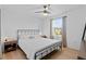 Bright bedroom features hardwood floors, a comfortable bed, and natural light for a peaceful atmosphere at 242 Milestone Dr, Haines City, FL 33844