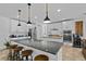Modern kitchen with granite countertops, stainless steel appliances, and pendant lighting at 242 Milestone Dr, Haines City, FL 33844