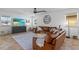 Inviting living room showcases a large brown leather couch, fan and natural light at 242 Milestone Dr, Haines City, FL 33844
