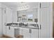 Beautiful main bathroom featuring granite countertops, double sinks, and white cabinetry at 242 Milestone Dr, Haines City, FL 33844