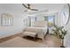 Bright main bedroom featuring tray ceilings, luxury vinyl plank flooring, and lots of natural light at 242 Milestone Dr, Haines City, FL 33844