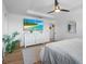 Bright main bedroom featuring tray ceilings, luxury vinyl plank flooring, neutral paint and lots of natural light at 242 Milestone Dr, Haines City, FL 33844