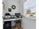 Bright home office includes a built-in desk, natural light, and a modern chair for a productive workspace at 242 Milestone Dr, Haines City, FL 33844