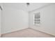 Bedroom features neutral carpet, a window with blinds and electrical outlets at 2460 Formax Dr, Orlando, FL 32828