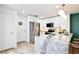 Bright kitchen featuring white cabinets, stainless steel appliances, and a marble island at 2460 Formax Dr, Orlando, FL 32828