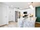 Bright kitchen featuring white cabinets, stainless steel appliances, and a marble island at 2460 Formax Dr, Orlando, FL 32828
