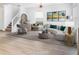 Virtually staged living room with modern furniture, decor, and light wood floors for an inviting atmosphere at 2460 Formax Dr, Orlando, FL 32828