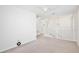 Bright loft features neutral carpet, a chandelier and white walls at 2460 Formax Dr, Orlando, FL 32828