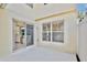 Back patio with sliding glass doors to interior at 2460 Formax Dr, Orlando, FL 32828