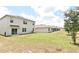 Large backyard featuring well-maintained lawn and ample space, great for outdoor enjoyment at 2524 Harmonia Hammock Rd, Harmony, FL 34773
