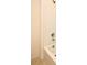 A bright bathroom features a shower with white square tiling and a tub at 2524 Harmonia Hammock Rd, Harmony, FL 34773
